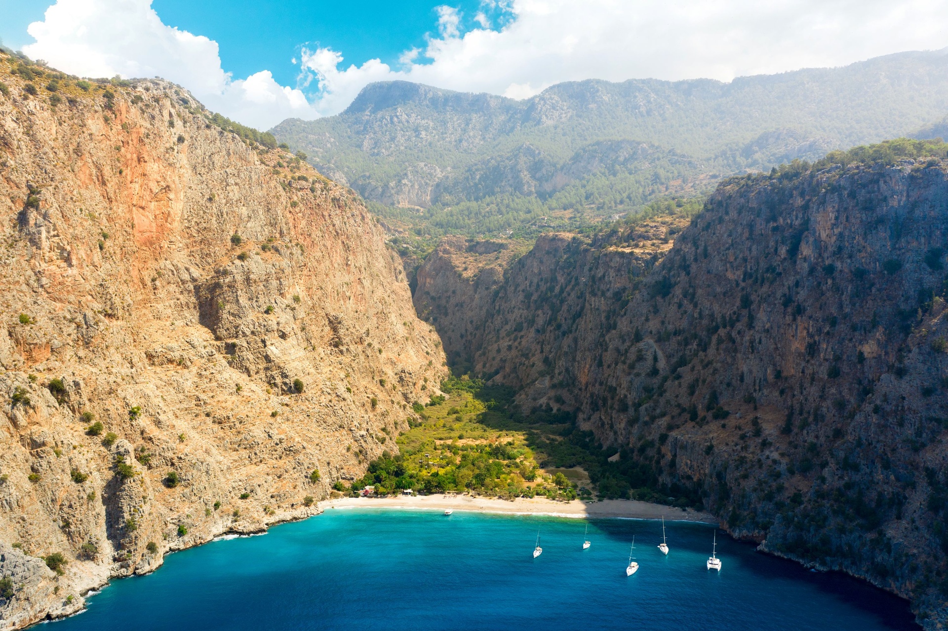 Butterfly Valley on the Lycian Way, Türkiye — turquoise cove framed by towering cliffs